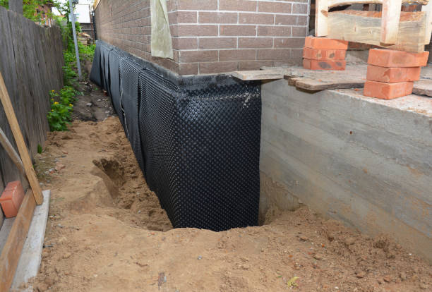 Happy homeowners after waterproofing job in Pedricktown